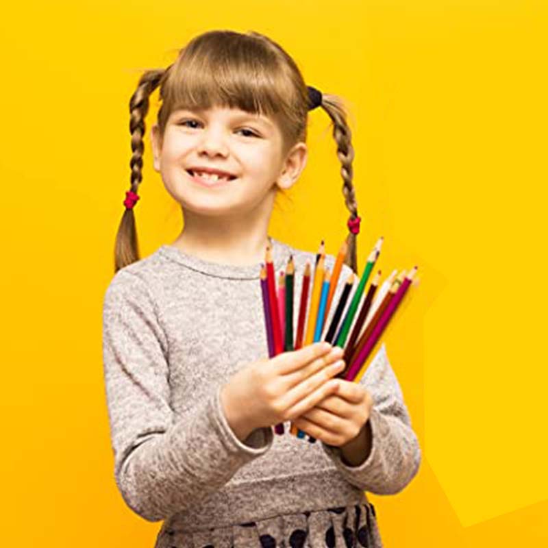 kid with watercolors pencils